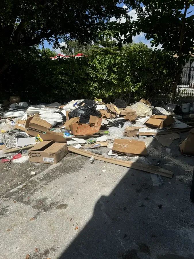 Renovation and construction debris piled up before a Waste Masters pickup near Miami Lakes, FL